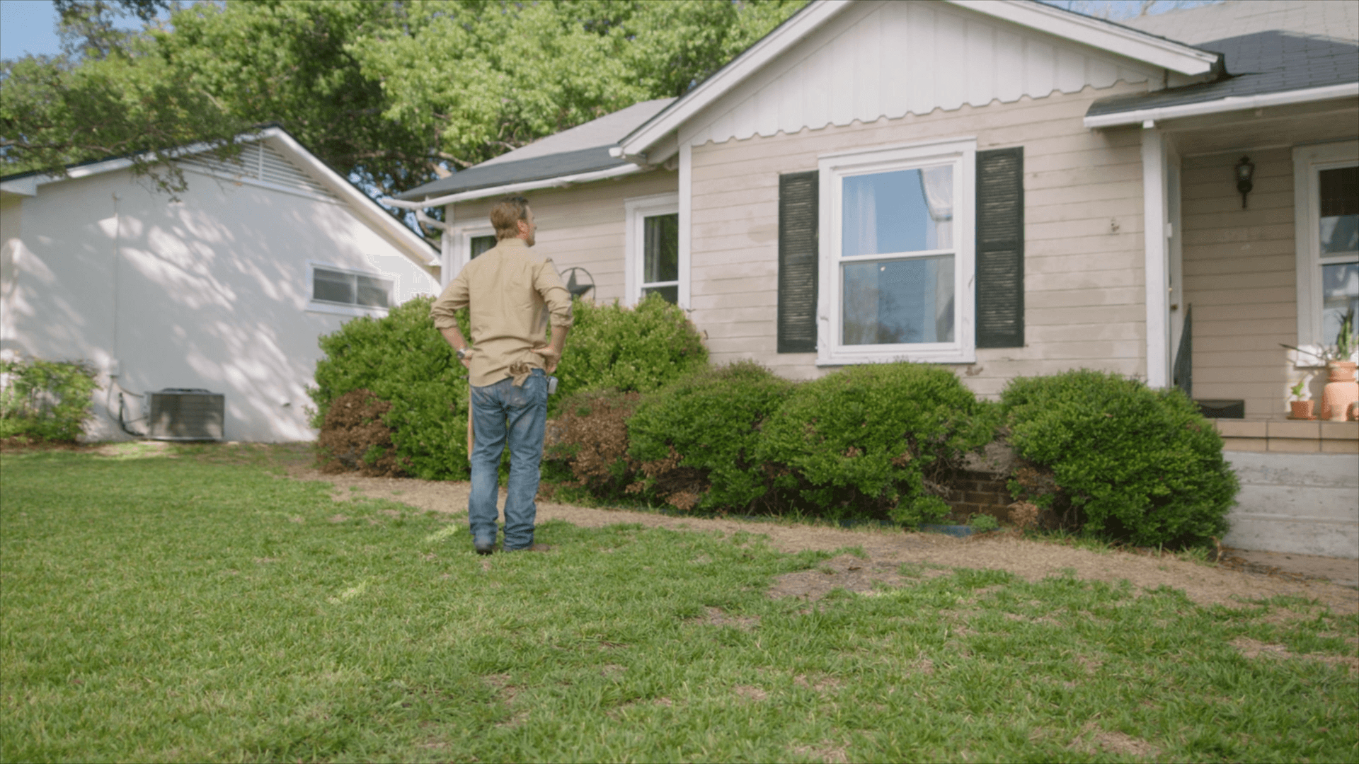 Decide to Re-side: Chip Gaines examines the siding on a home Chip Gaines examines the damaged siding on a home