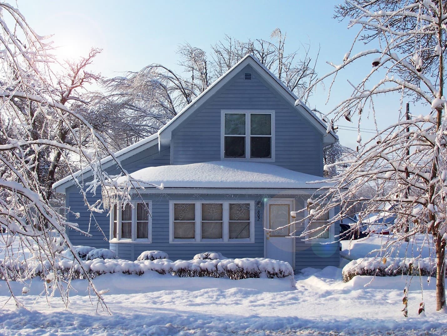 best-siding-for-cold-image-6 Snow covered house with blue James Hardie Siding