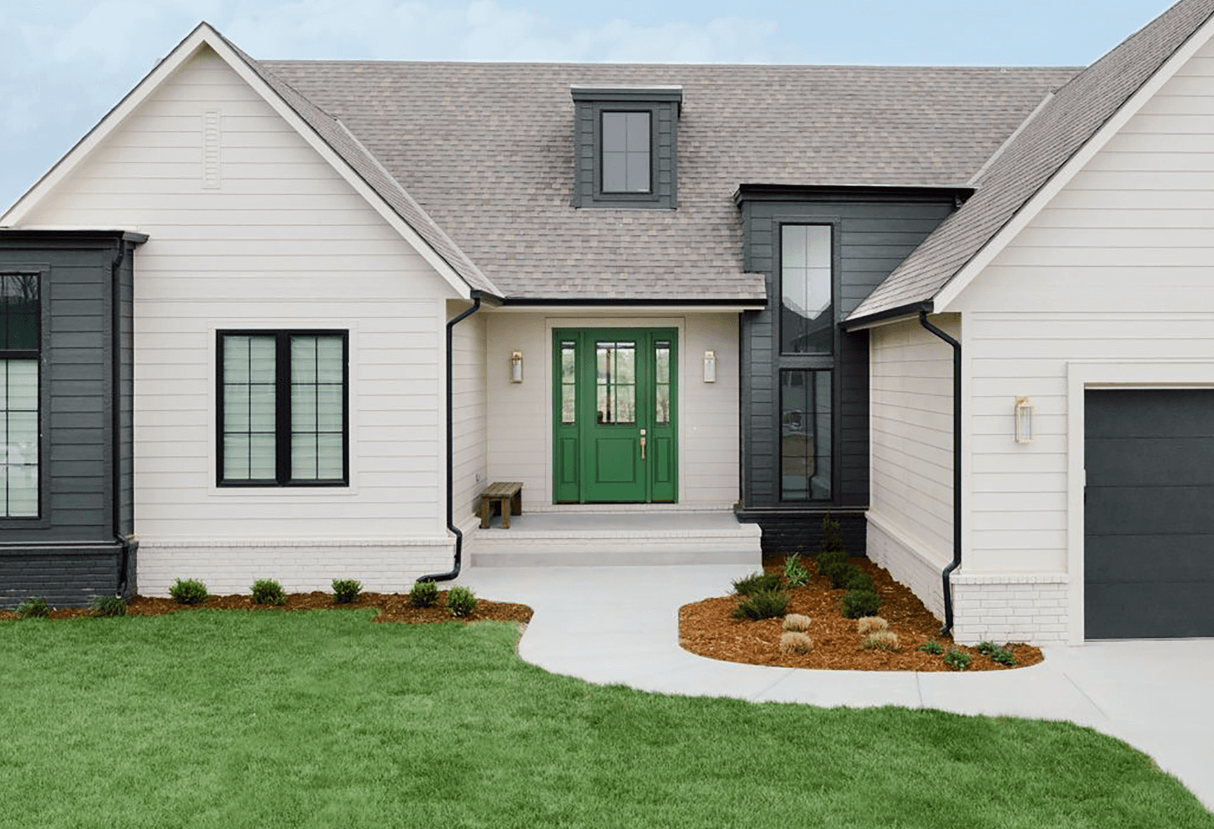 Enhancing Your Home's Exterior: Home clad in Hardie® Select Cedarmill Plank with a bright green door Home clad in Hardie® Select Cedarmill Plank with a bright green door