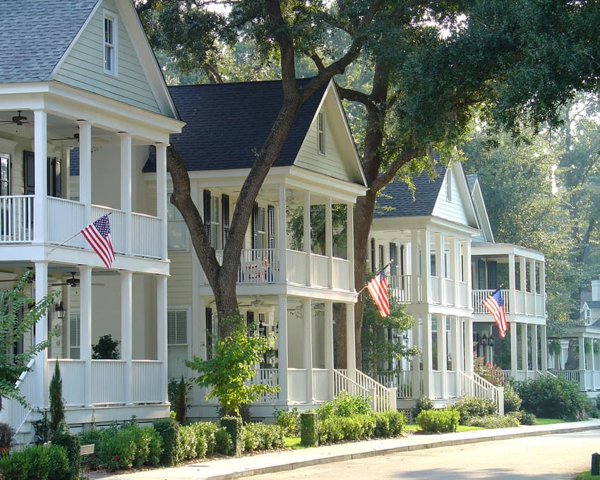 successful-streetscape-2 Streetscape of two-story homes with American flags on front porch