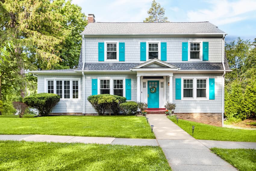 Enhancing Your Home's Exterior: Two story colonial house with Pearl Gray Hardie® Straight Edge Shingle with robin's egg blue shutters Two story colonial house with Pearl Gray Hardie® Straight Edge Shingle with robin's egg blue shutters